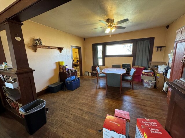 dining space featuring a ceiling fan and wood finished floors