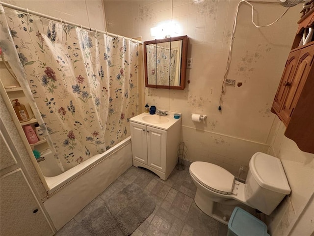 full bathroom featuring vanity, toilet, and shower / tub combo
