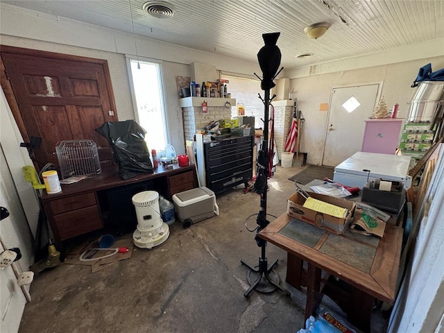 miscellaneous room with concrete floors and visible vents