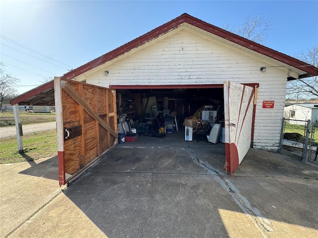 garage with concrete driveway