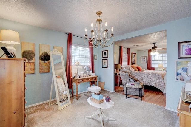 carpeted bedroom featuring an inviting chandelier, multiple windows, baseboards, and a textured ceiling