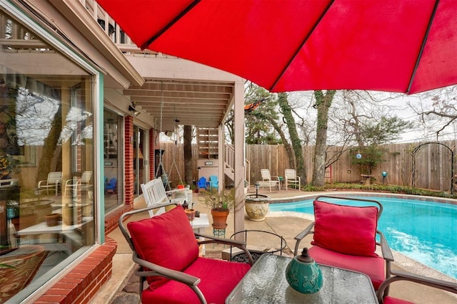 view of pool featuring a patio area, stairway, a fenced backyard, and a fenced in pool