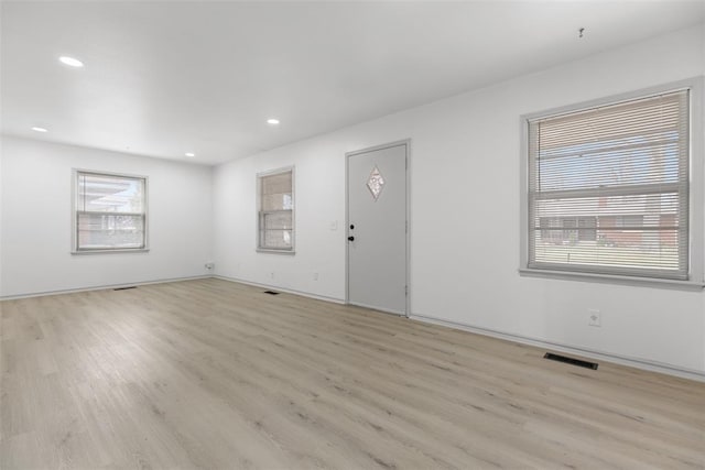 entryway with recessed lighting, visible vents, a healthy amount of sunlight, and light wood-style flooring