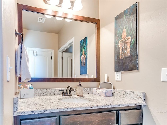 bathroom featuring visible vents and vanity