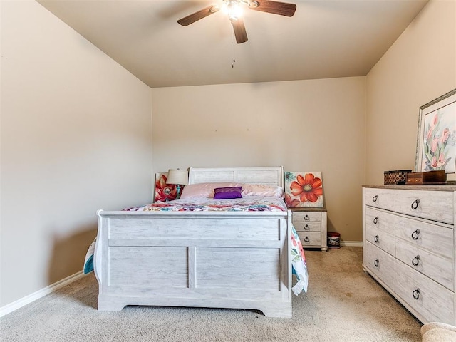 bedroom with baseboards, light colored carpet, and a ceiling fan