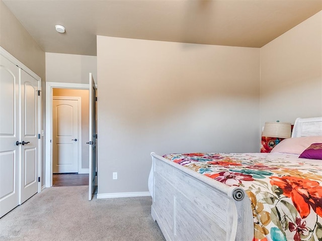 carpeted bedroom with baseboards