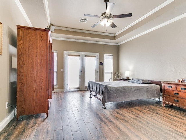 bedroom with wood finished floors, visible vents, ornamental molding, access to exterior, and french doors