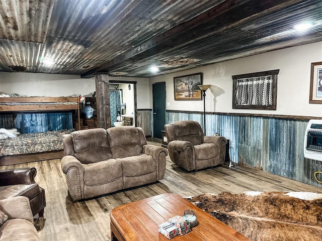 living room featuring a wainscoted wall, heating unit, wood ceiling, and wood finished floors