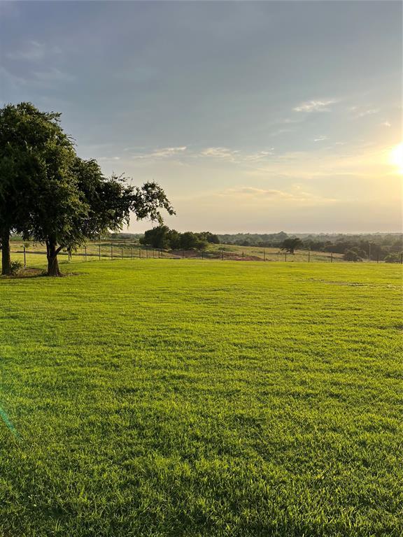 nature at dusk featuring a rural view