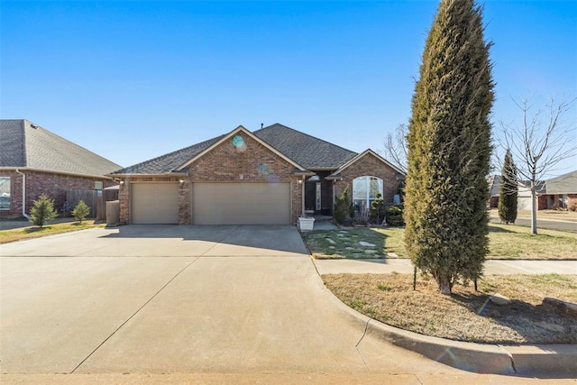 view of front of home with fence, roof with shingles, concrete driveway, a garage, and brick siding