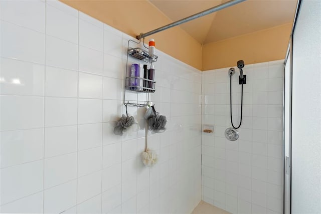 full bath with a tile shower