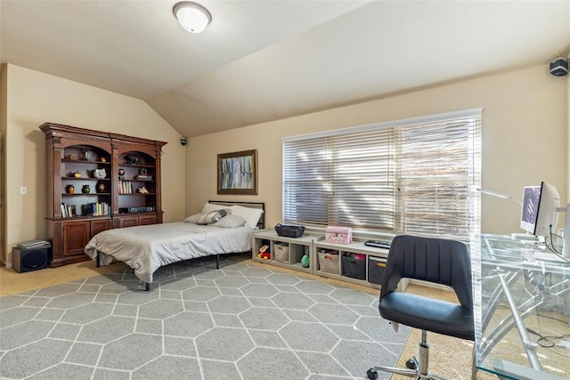 bedroom featuring light carpet and lofted ceiling