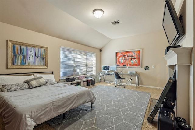 carpeted bedroom with visible vents, baseboards, and vaulted ceiling