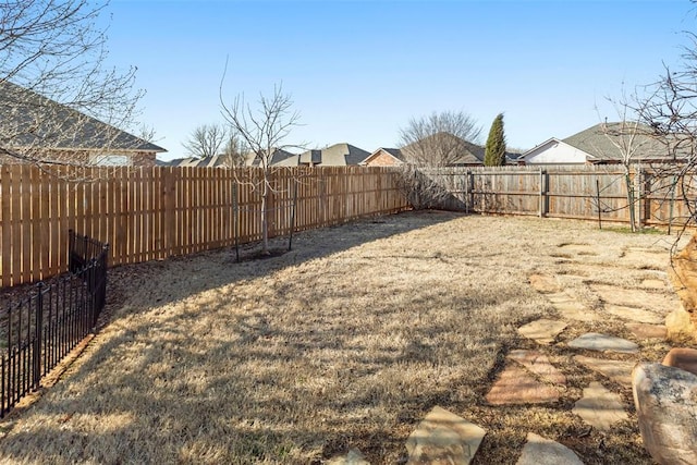 view of yard featuring a fenced backyard