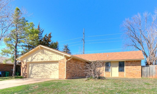 single story home with brick siding, concrete driveway, an attached garage, and fence