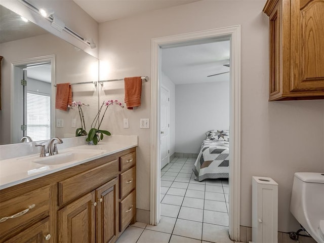 bathroom featuring tile patterned floors, toilet, and vanity