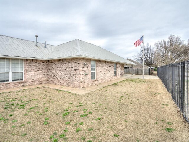 view of yard featuring a patio and a fenced backyard