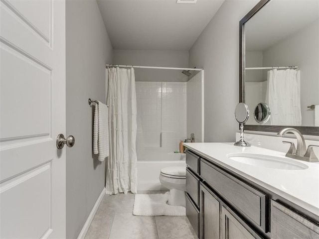 full bathroom with vanity, baseboards, tile patterned flooring, shower / bath combination with curtain, and toilet