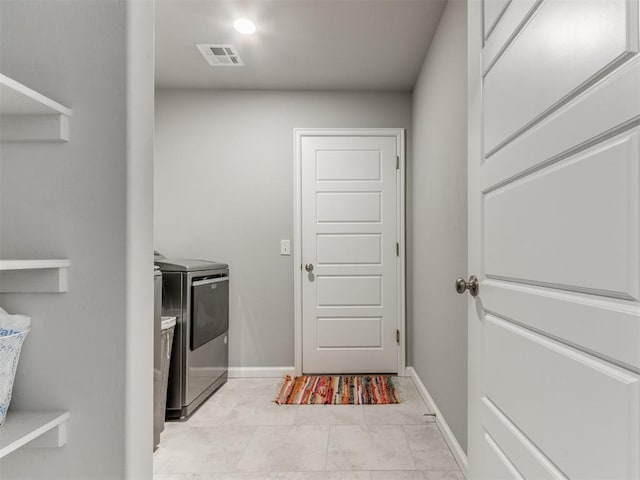 laundry area with washer and dryer, laundry area, baseboards, and visible vents