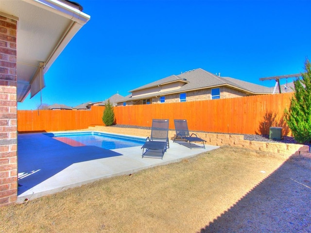 view of pool featuring a patio and a fenced backyard