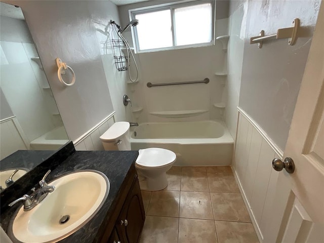 full bathroom with tile patterned floors, toilet, vanity, and washtub / shower combination