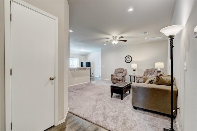 living area featuring carpet, a ceiling fan, visible vents, baseboards, and recessed lighting