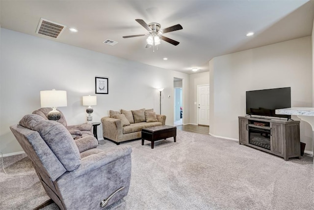 living area with recessed lighting, visible vents, light colored carpet, and a ceiling fan