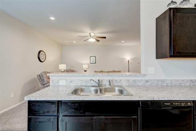 kitchen with dishwasher, light countertops, and a sink