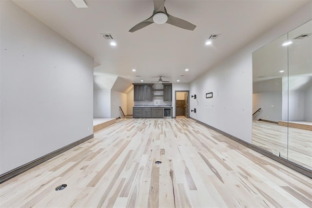 unfurnished living room featuring recessed lighting, visible vents, light wood-style floors, and a ceiling fan