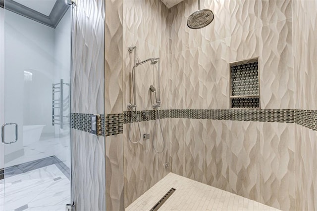 2747 Walking Woods Trl, Edmond, OK 73049 - bathroom with a shower stall, marble finish floors, tile walls, and ornamental molding