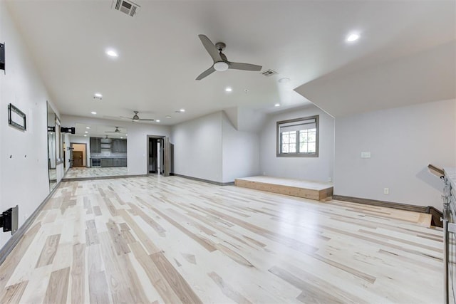 2747 Walking Woods Trl, Edmond, OK 73049 - unfurnished living room with a ceiling fan, light wood finished floors, recessed lighting, and baseboards