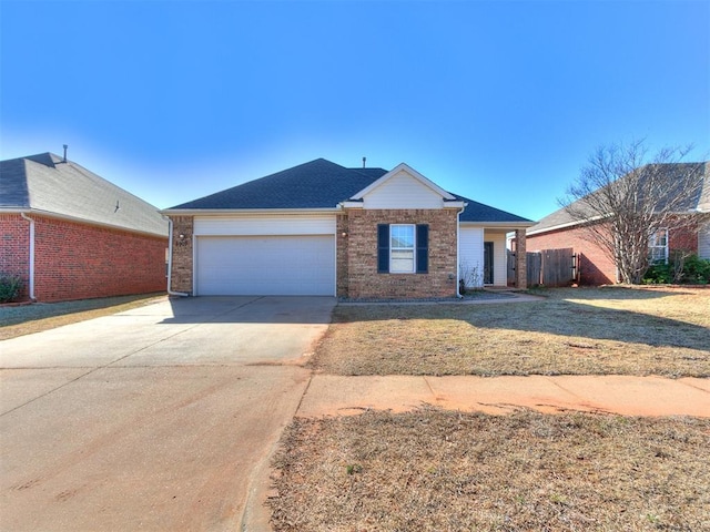 ranch-style home with a front yard, fence, concrete driveway, a garage, and brick siding