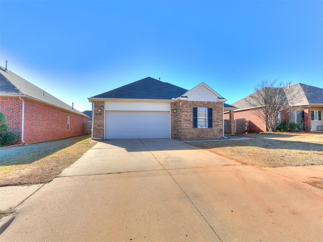 ranch-style house with brick siding, driveway, and a garage