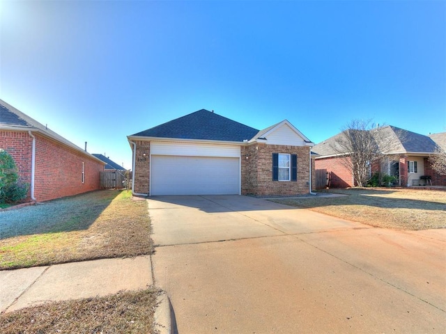 single story home with a front lawn, driveway, fence, a garage, and brick siding