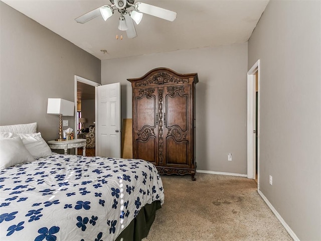 carpeted bedroom featuring a ceiling fan and baseboards