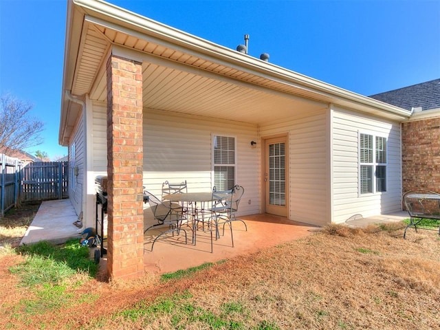 view of patio featuring fence