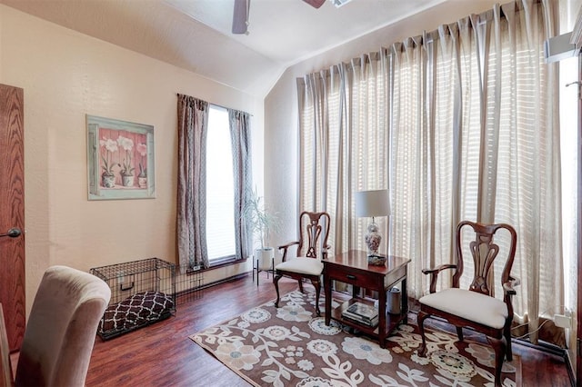 sitting room featuring lofted ceiling, wood finished floors, and ceiling fan