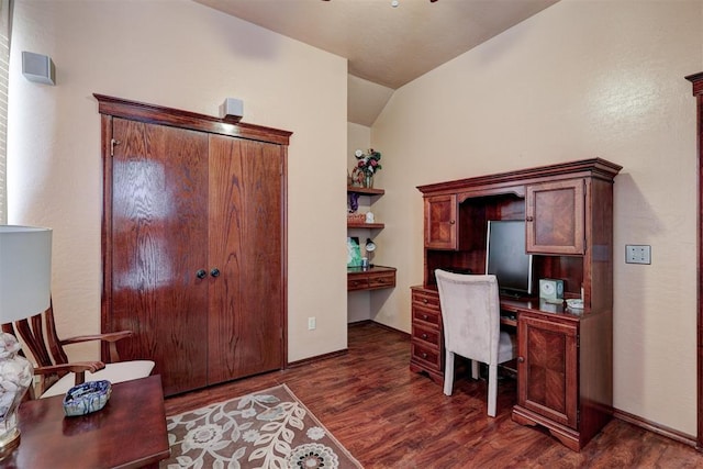 office with dark wood finished floors, lofted ceiling, and baseboards