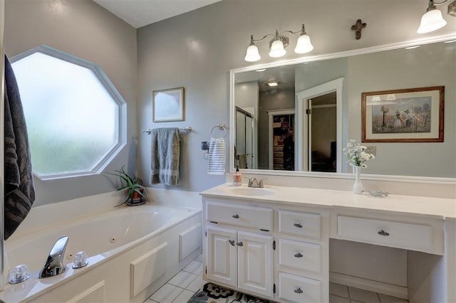 bathroom featuring tile patterned flooring, a stall shower, vanity, and a whirlpool tub