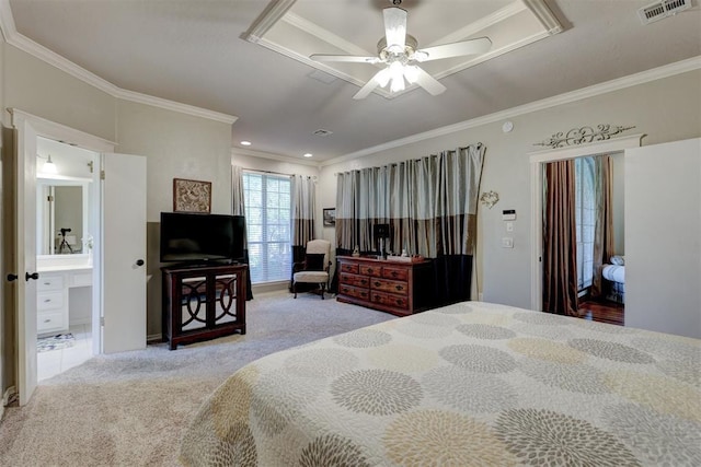 bedroom featuring ensuite bath, crown molding, visible vents, and carpet floors