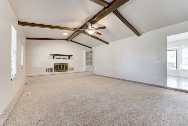 unfurnished living room with visible vents, lofted ceiling with beams, ceiling fan, and carpet floors