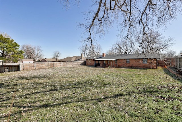 view of yard featuring a fenced backyard