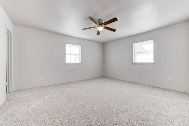 spare room with carpet flooring and ceiling fan