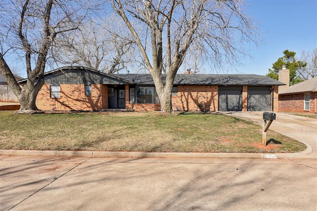 mid-century inspired home with a chimney, an attached garage, concrete driveway, and a front lawn