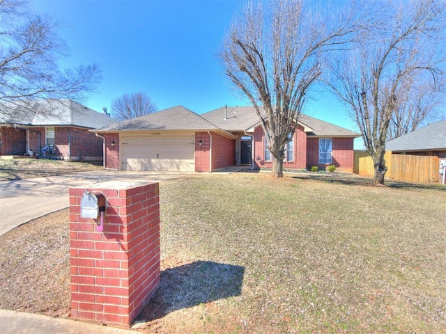 ranch-style house with fence, an attached garage, concrete driveway, a front lawn, and brick siding