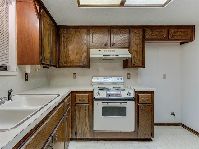 kitchen with under cabinet range hood, a sink, white electric range oven, light countertops, and baseboards