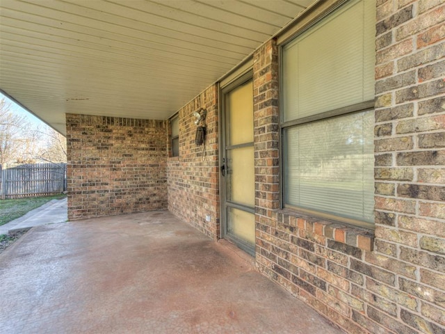 view of patio / terrace featuring fence