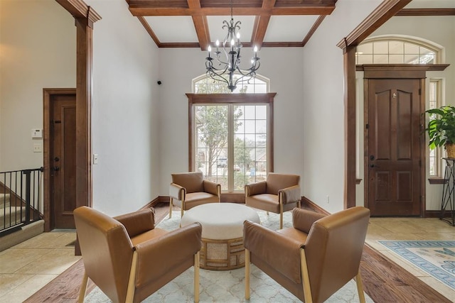 interior space with baseboards, a chandelier, beamed ceiling, stairway, and coffered ceiling