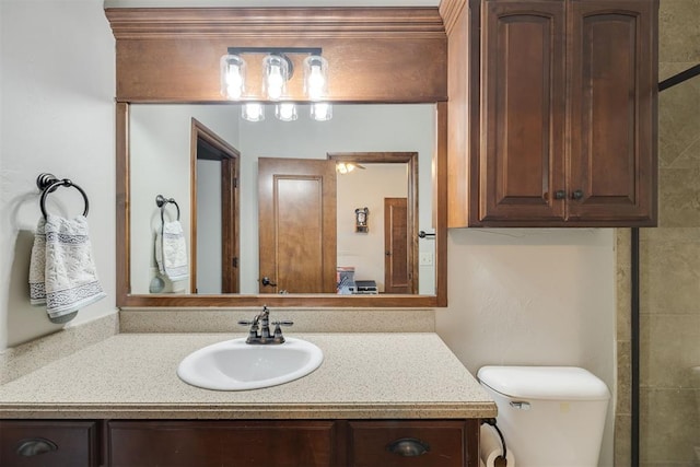 bathroom featuring toilet and vanity