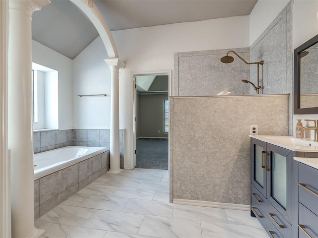 bathroom featuring a walk in shower, a garden tub, marble finish floor, vanity, and ornate columns